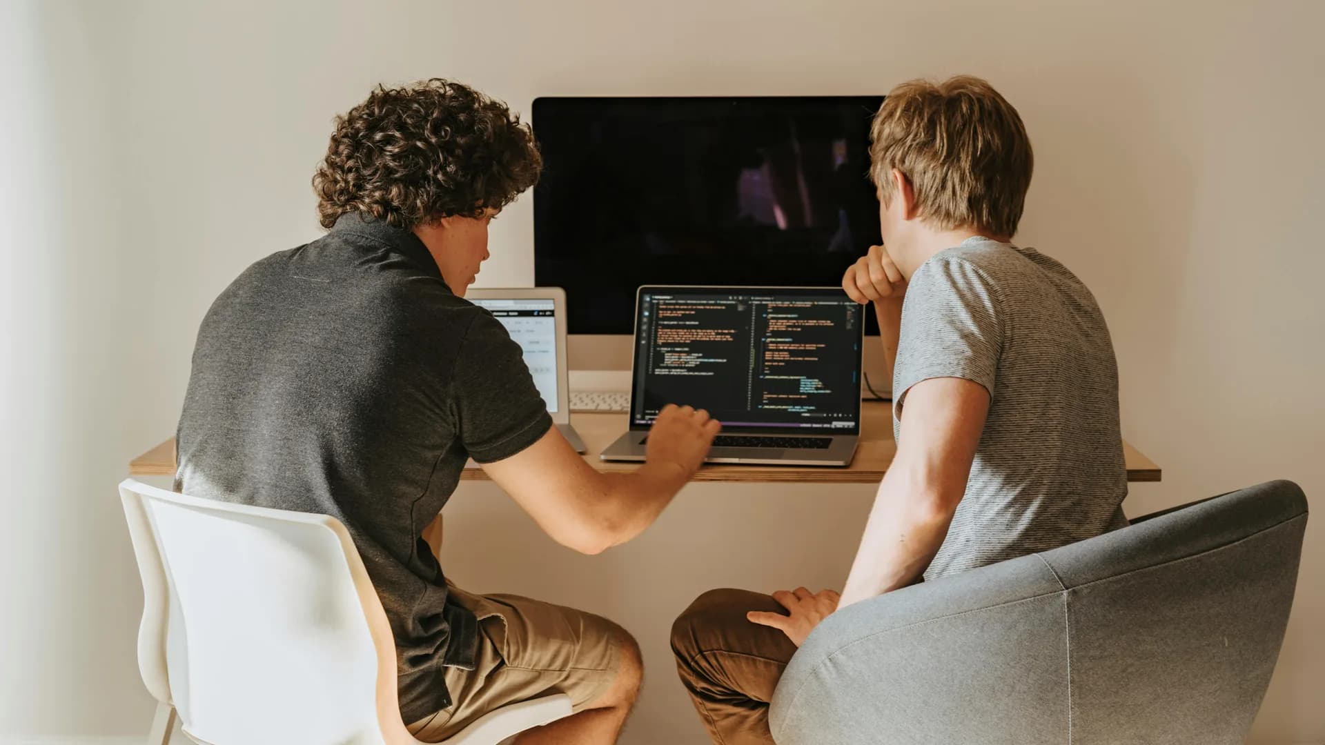 Software developers collaborating over application code
